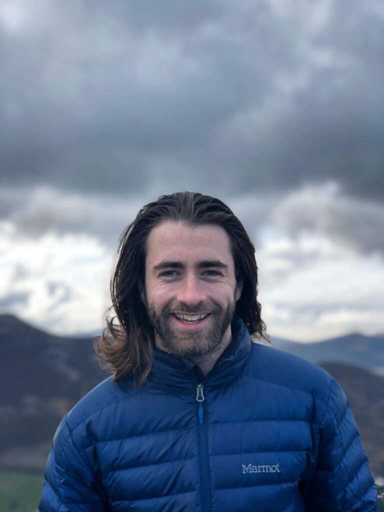 oisin-hoy-smiling-in-mountains